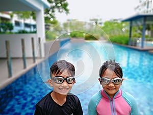 Kids ready for swimming at the swimming pool.