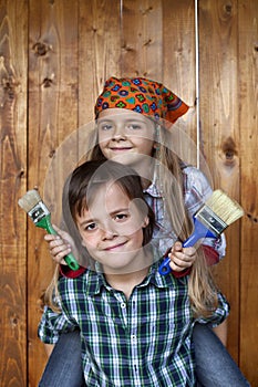 Kids ready to repaint wooden wall