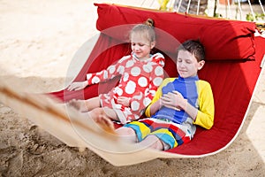 Kids relaxing in hammock