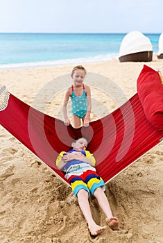 Kids relaxing in hammock