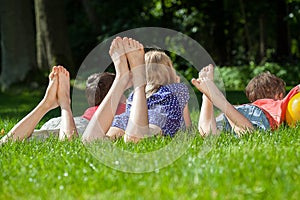 Kids relaxing in park photo