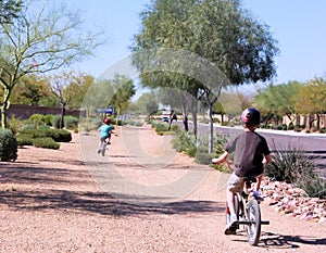 Kids Riding Bikes Wearing Helmets