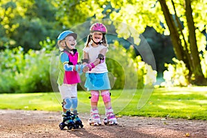 Kids roller skating in summer park