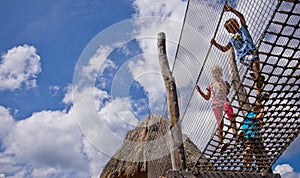 Kids on rope ladder