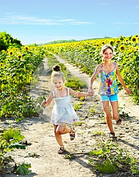 Kids running across field outdoor.