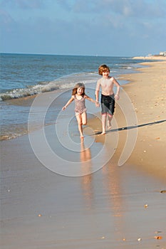 Kids running on the beach