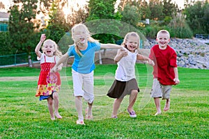 Kids running on the grass