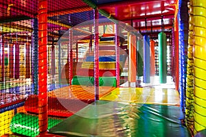 Kids running inside a Colorful indoor playground