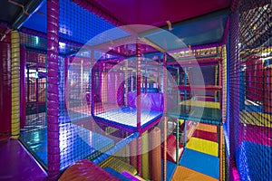 Kids running inside a Colorful indoor playground