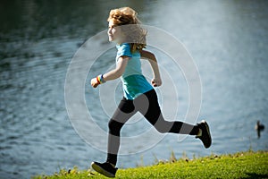 Kids running outdoors. Child runner jogger running in the nature. Morning jogging. Active healthy kids lifestyle