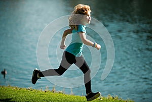 Kids running outdoors. Child runner jogger running in the nature. Morning jogging. Active healthy kids lifestyle