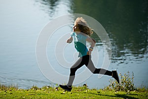 Kids running outdoors. Child runner jogger running in the nature. Morning jogging. Active healthy kids lifestyle. Active