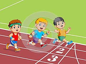 Kids running on the track of stadium