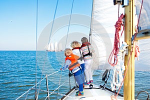 Kids sail on yacht in sea. Child sailing on boat.