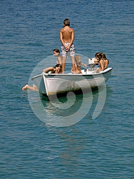 Kids sailng at sea