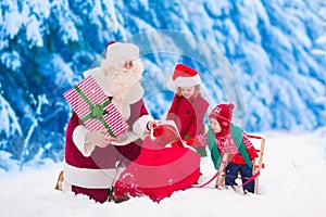 Kids and Santa with Christmas presents