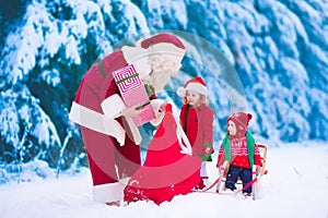 Kids and Santa with Christmas presents
