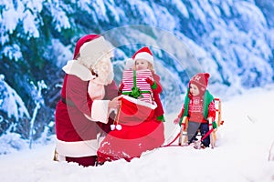 Kids and Santa with Christmas presents