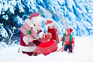 Kids and Santa with Christmas presents