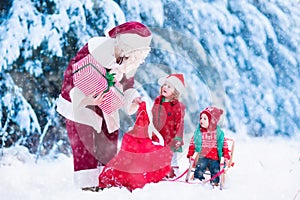 Kids and Santa with Christmas presents