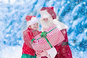 Kids and Santa with Christmas presents