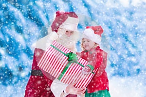 Kids and Santa with Christmas presents