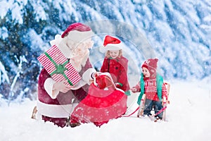 Kids and Santa with Christmas presents