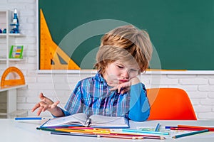 Kids Science education concept. Cute pupil with funny face schooling work. Home schooling. Little ready to study. Little