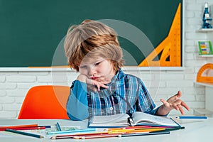 Kids Science education concept. Cute pupil with funny face schooling work. Home schooling. Little ready to study. Little