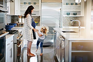 Kids see the world as a place of nonstop fun. a pregnant woman bonding with her little son at home.