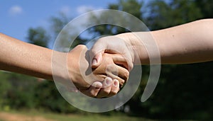 Kids shaking hands.