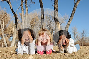 Kids shielding sun from eyes photo
