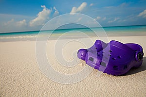 Kids shoes on the beach