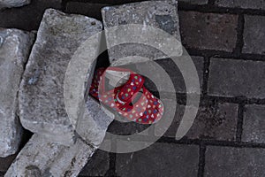 Kids shoes on representing civilian casualties in an active war zone