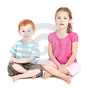 Kids sitting on floor isolated photo