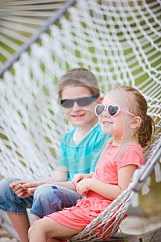 Kids sitting in hammock