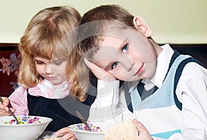 Kids sitting at table during a dinner