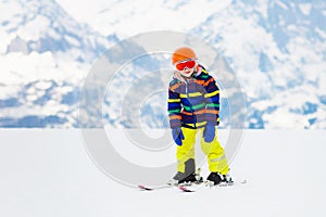 Kids ski. Winter family snow sport. Child skiing