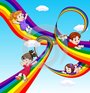 Kids sliding on rainbow in sky