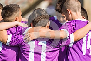 Kids soccer football - children players celebrating after victo