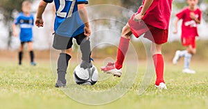 Kids soccer football - children players match on soccer field