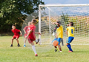 Kids soccer football - children players match on soccer field