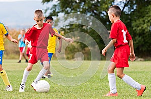 Kids soccer football - children players match on soccer field