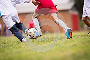 Kids soccer football - children players match on soccer field