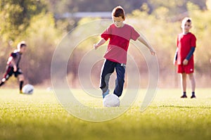 Kids soccer football - children players match on soccer field