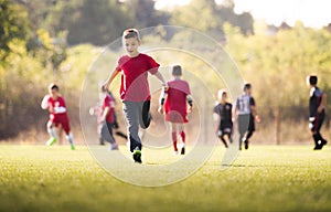 Kids soccer football - children players match on soccer field