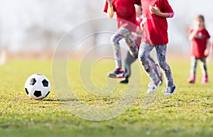 Kids soccer football - children players match on soccer field