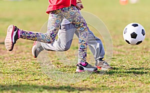 Kids soccer football - children players match on soccer field