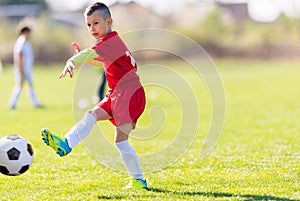 Kids soccer football - children players match on soccer field