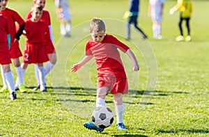 Kids soccer football - children players match on soccer field